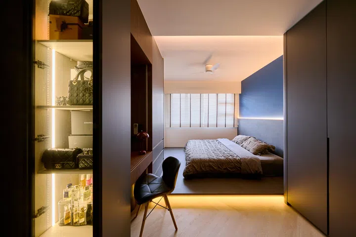 Master bedroom with a handbag display in a 5-room HDB BTO in Woodlands.