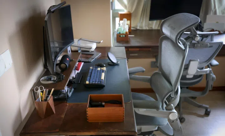 The couple made tabletops for their study desks out of raw wood planks sourced locally.