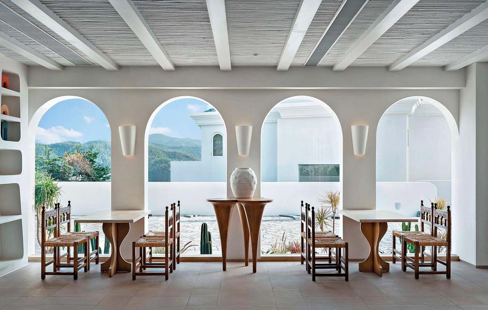 Arched doorways frame the beautiful sights of the scenery in the Blue & White Homestay by Miyue in Nan Ao, Guangdong