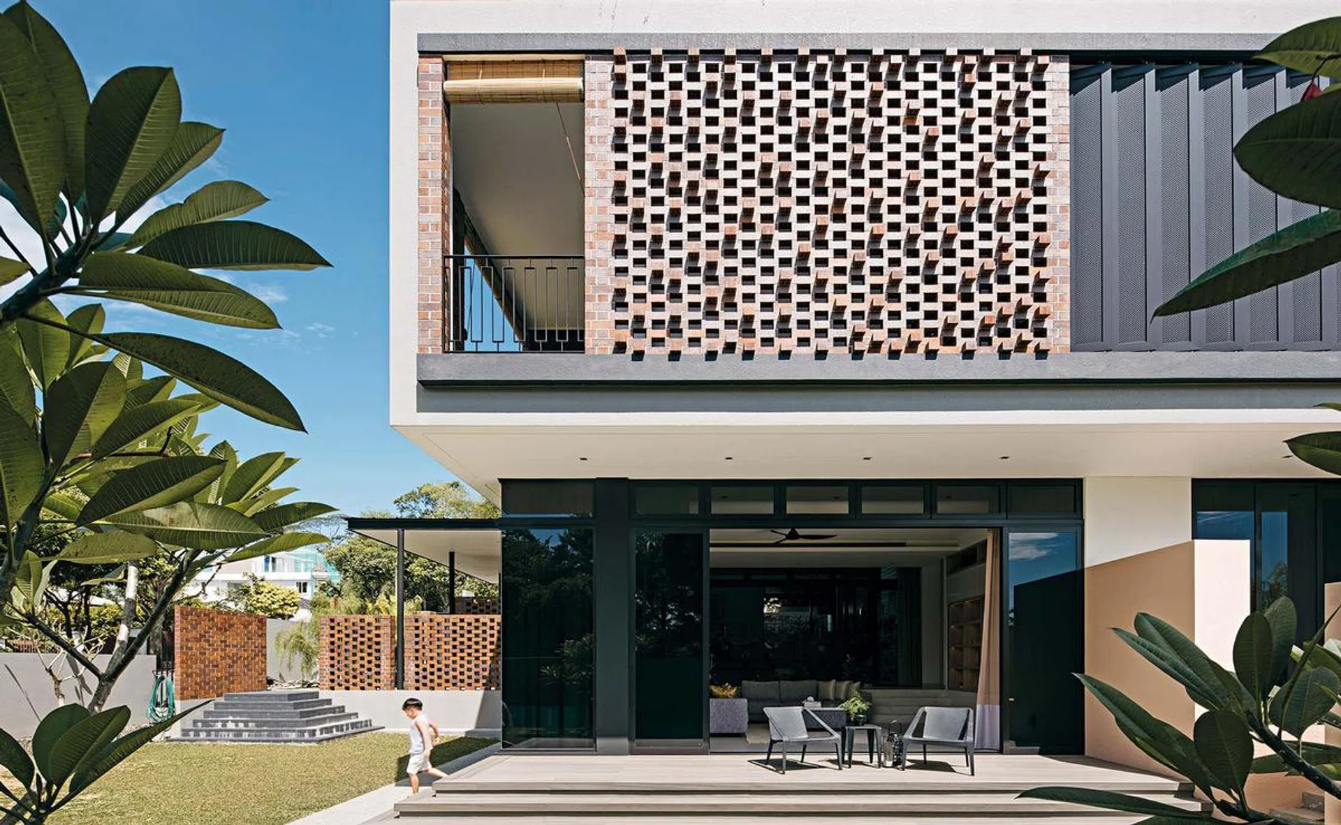 View of the facade of the home, featuring a red brick design.