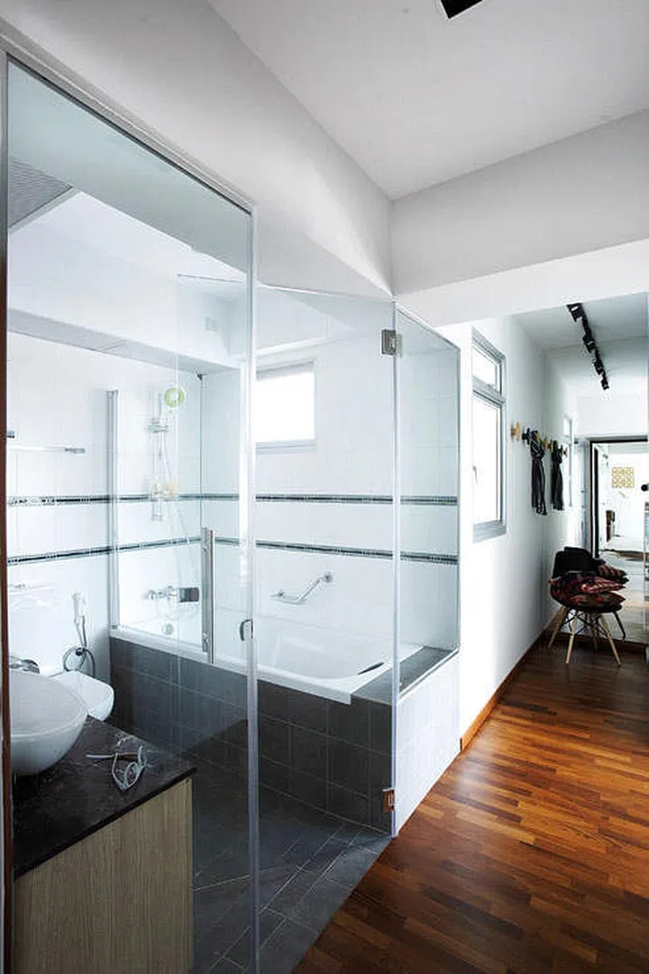 Glass doors for your en suite washroom allows you to have a sensual open concept bathroom but keep the area warm while you shower too. (Interior design by Fuse Concept)
