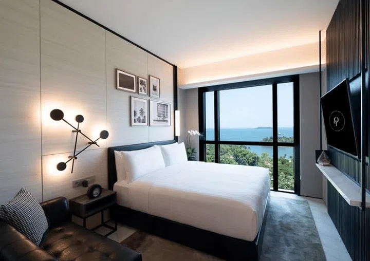 The Outpost Hotel Sentosa Deluxe Room Sea View. View of bed in hotel room