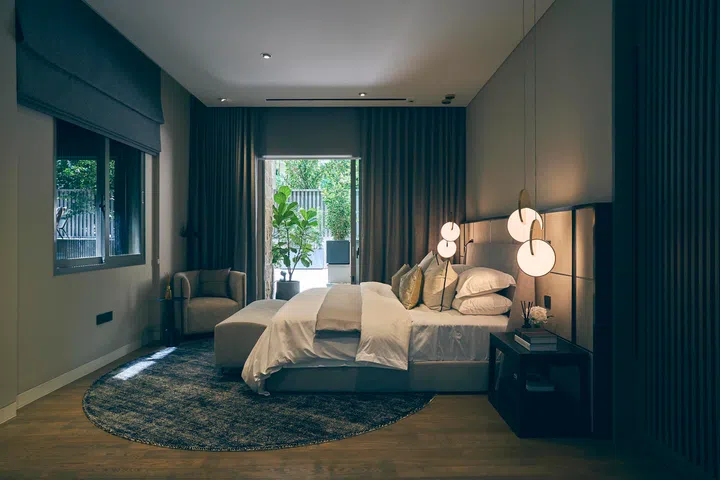  The master bedroom opens directly to the terrace, with natural light filtering through layers of drapery for a cocoon-like effect.
