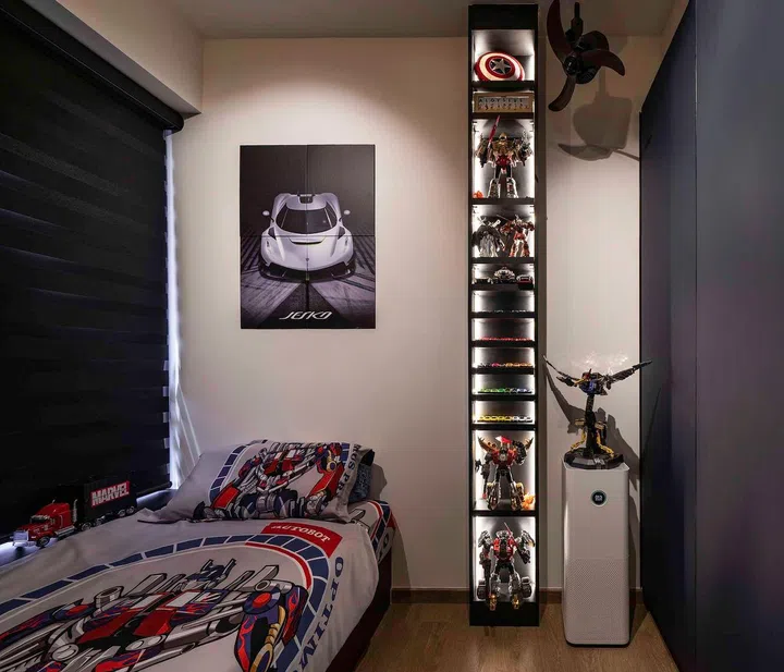 Dark interior design theme for the son's bedroom in this banking couple's 3-bedroom condominium in West Coast.