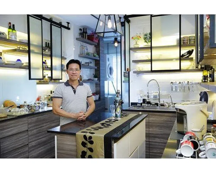 Homeowner Mr. Aeden Tang poses in his 4-room HDB flat in Choa Chu Kang.
