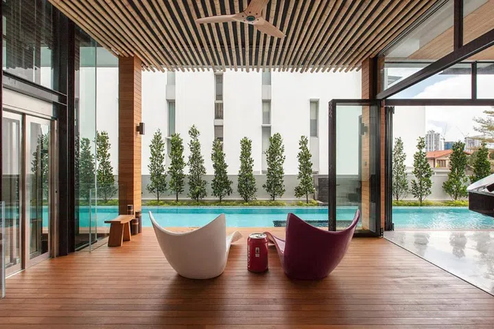 The first floor houses the living and dining areas, and a small deck that overlooks a 25m saltwater lap pool.