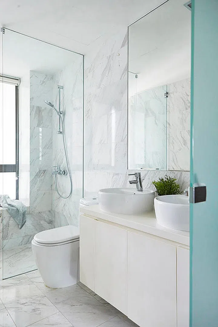 An all-white marble bathroom can never go wrong. Interior Design by Designworx