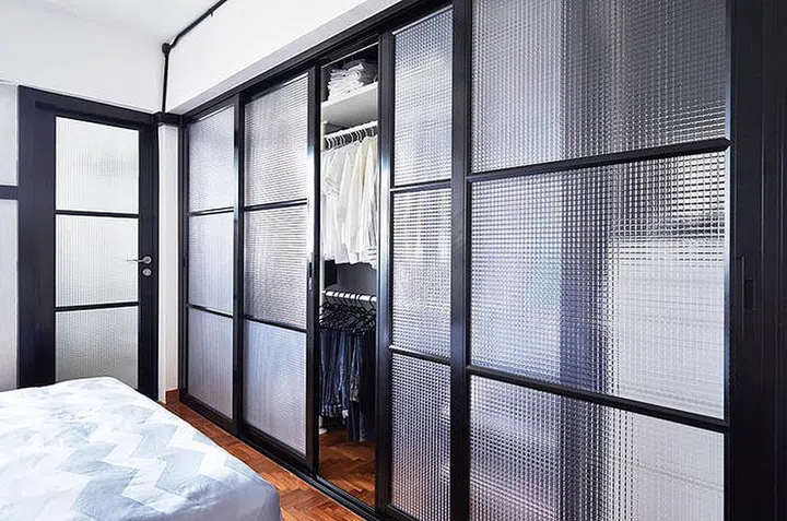 Maintaining the size of the bedroom, the owner's wardrobe ate into the original footprint of the kitchen instead.