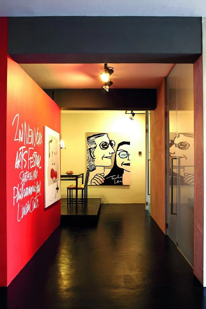 The entire flat was filled with the homeowner's favourite items, such as this graphic of John Lennon and Yoko Ono. The "graffiti" on the wall was pasted on.