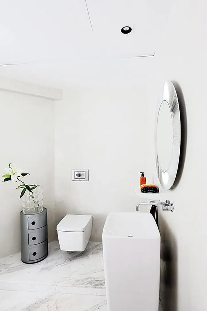 The bathrooms feature cementitious walls - walls with an engineered cement finish that is suitable for wet conditions, hence reducing the need for maintenance.