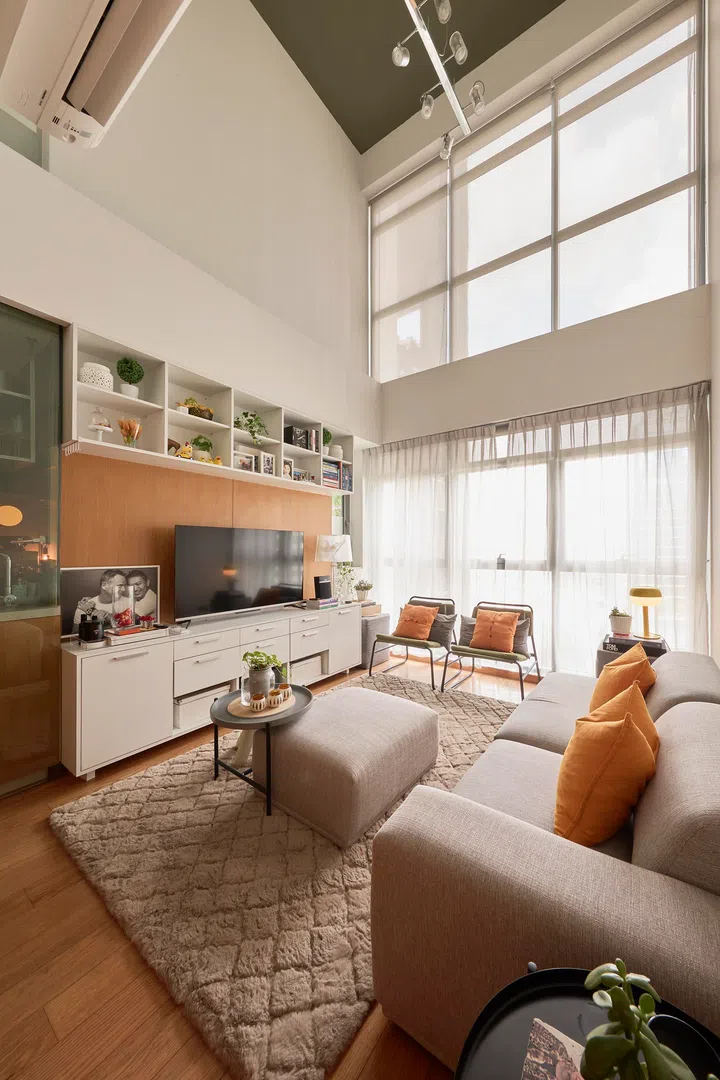 The double-volume living room is kept deliberately pared back, allowing natural light and height to define the space.