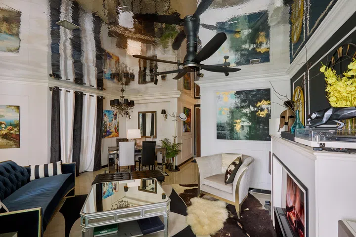 View of the living room and dining room (in the background).