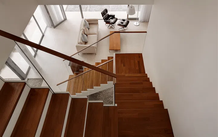 A void in the centre of the house is where the staircase now sits, which works to effectively separate the spaces in front and at the back, namely the living and dining room on the first floor, respectively.