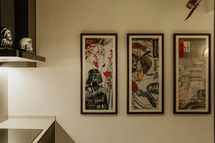 Graphic prints are treated as part of the home’s broader visual language, reinforcing the Star Wars theme without dominating the space.
