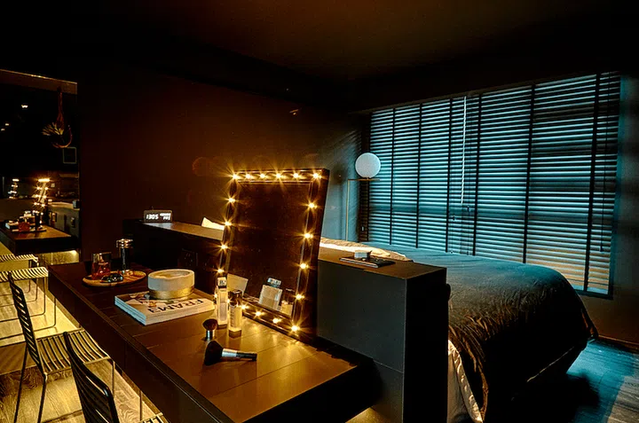 The headboard and bedroom vanity table dresser was inspired by the layout that many new hotels have adopted, says homeowner Sherlynn, who has experience in the hospitality industry.
