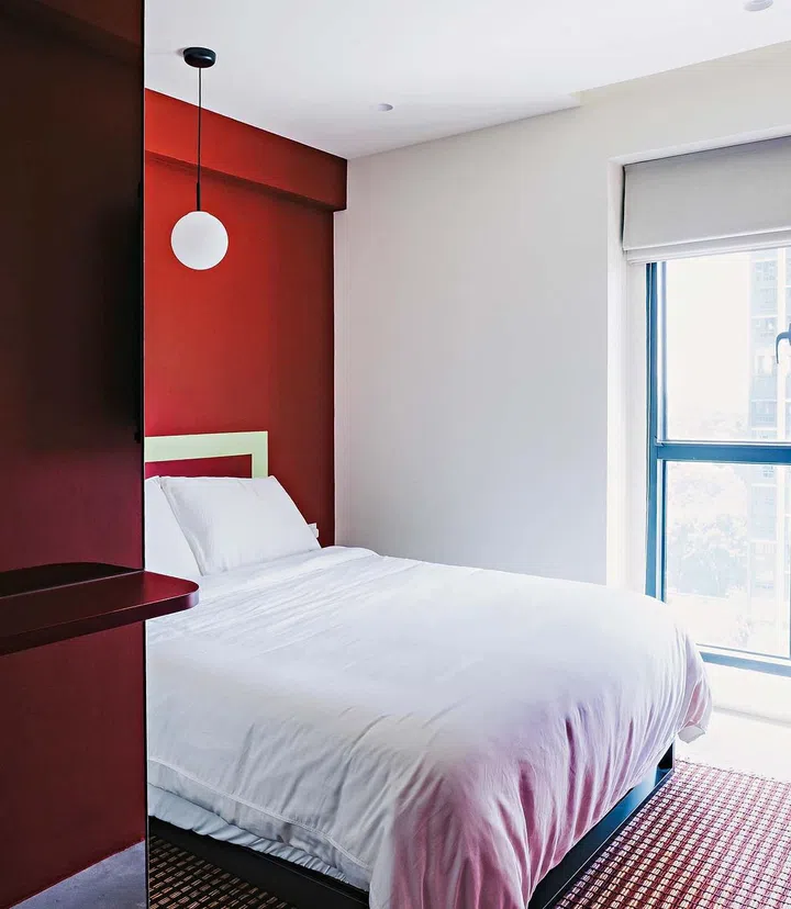 Like the other spaces, a striped rug was also chosen for the master bedroom.