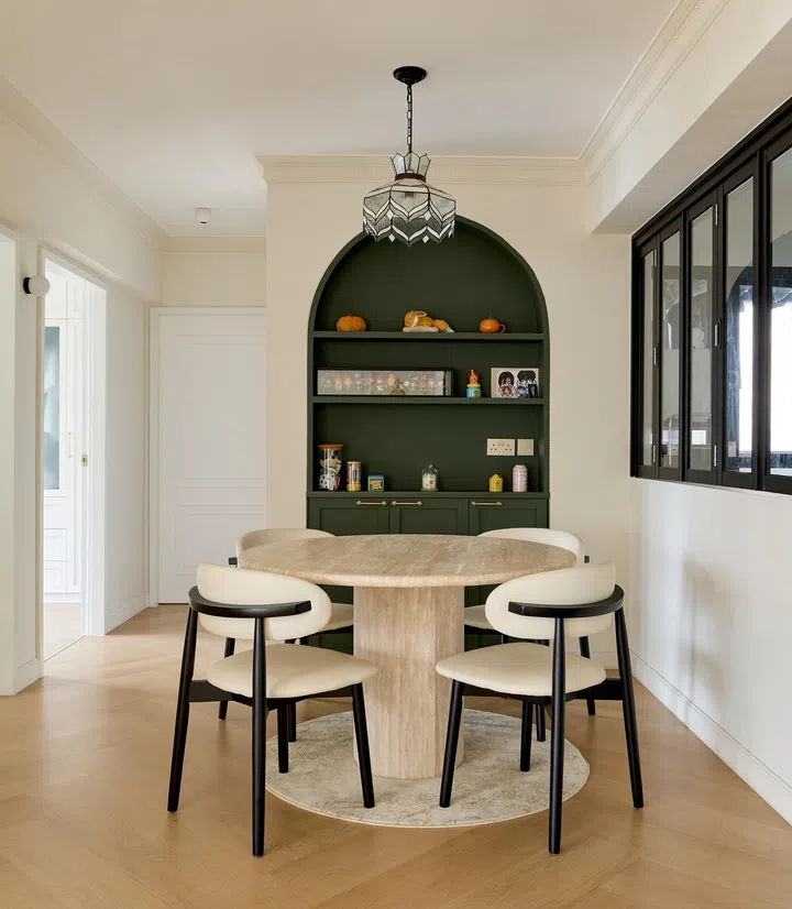The arched custom-built bookcase by the dining area.