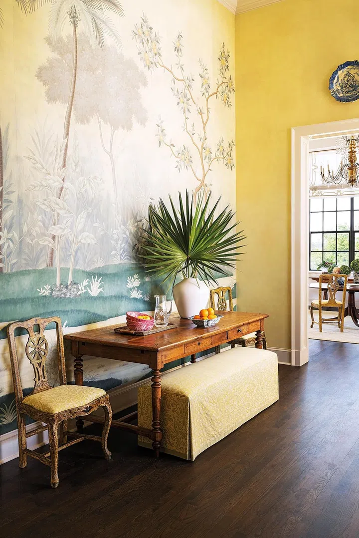 19th C. Fruitwood table. Custom bench covered in Fortuny fabric. Pair of Italian painted chairs in Fortuny fabric. Custom Mural by Gracie Studio.