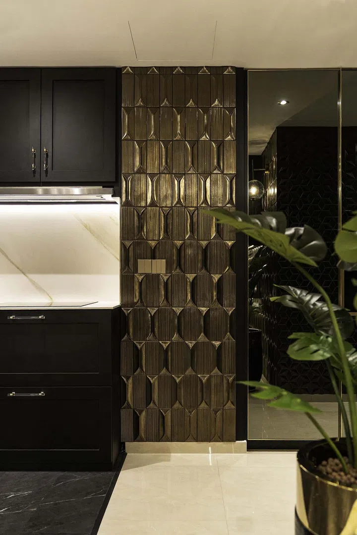 Black and gold modern luxury dry kitchen in a banking couple's 3-bedroom condominium in West Coast.