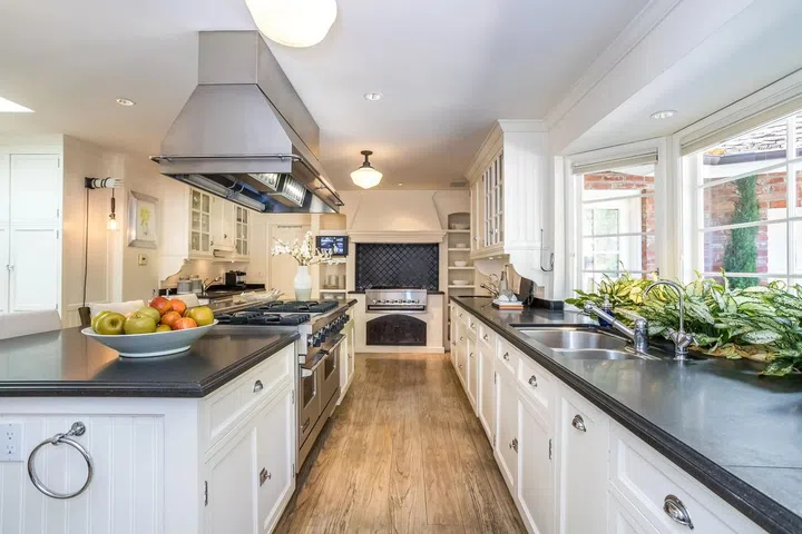 The well-appointed chef's kitchen includes an indoor BBQ.