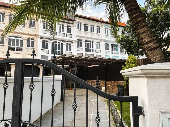 View of a private driveway leading into a terrace house at Loyang Villas. Image StackedHomes.