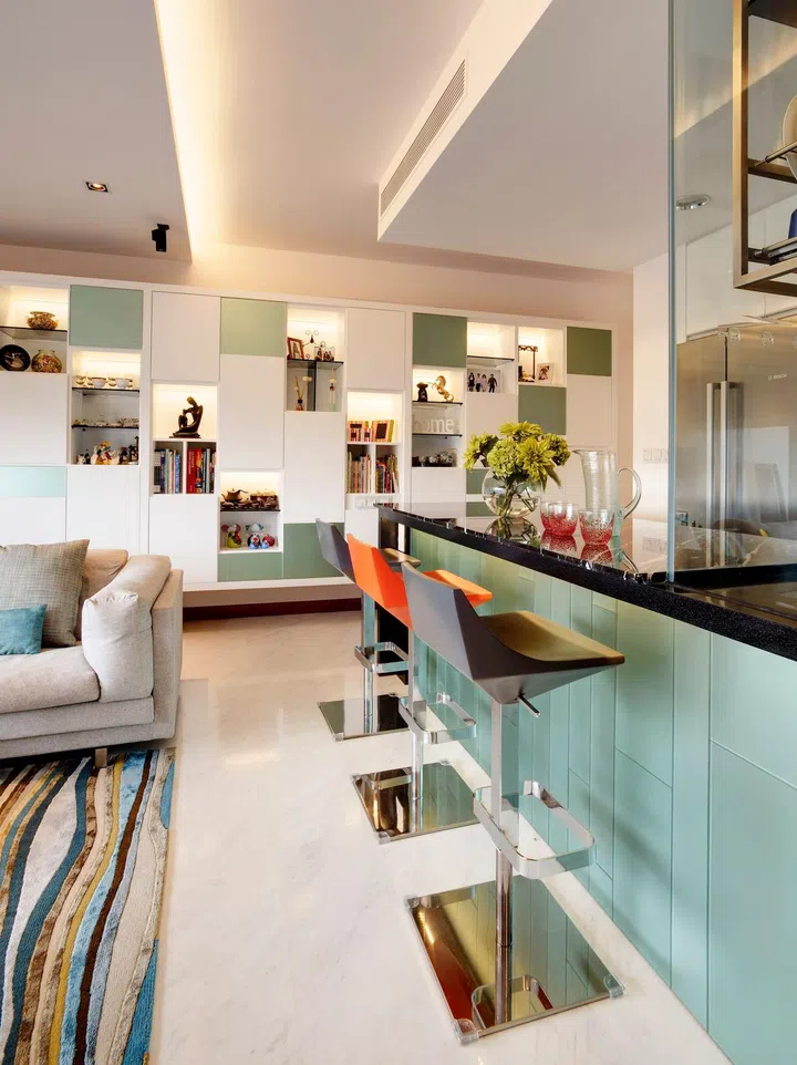 Kitchen island dining table in a family of four's condominium in Marine Parade. $100,000 Renovation by interior designer Lisa Ng from Ansana.