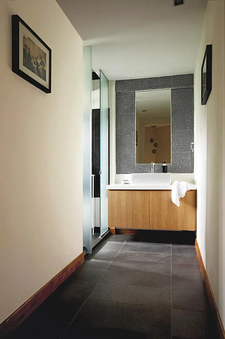 What was once the master bedroom is now a large space incorporating the powder room and walk-in wardrobe. Interior design by I-Bridge Design