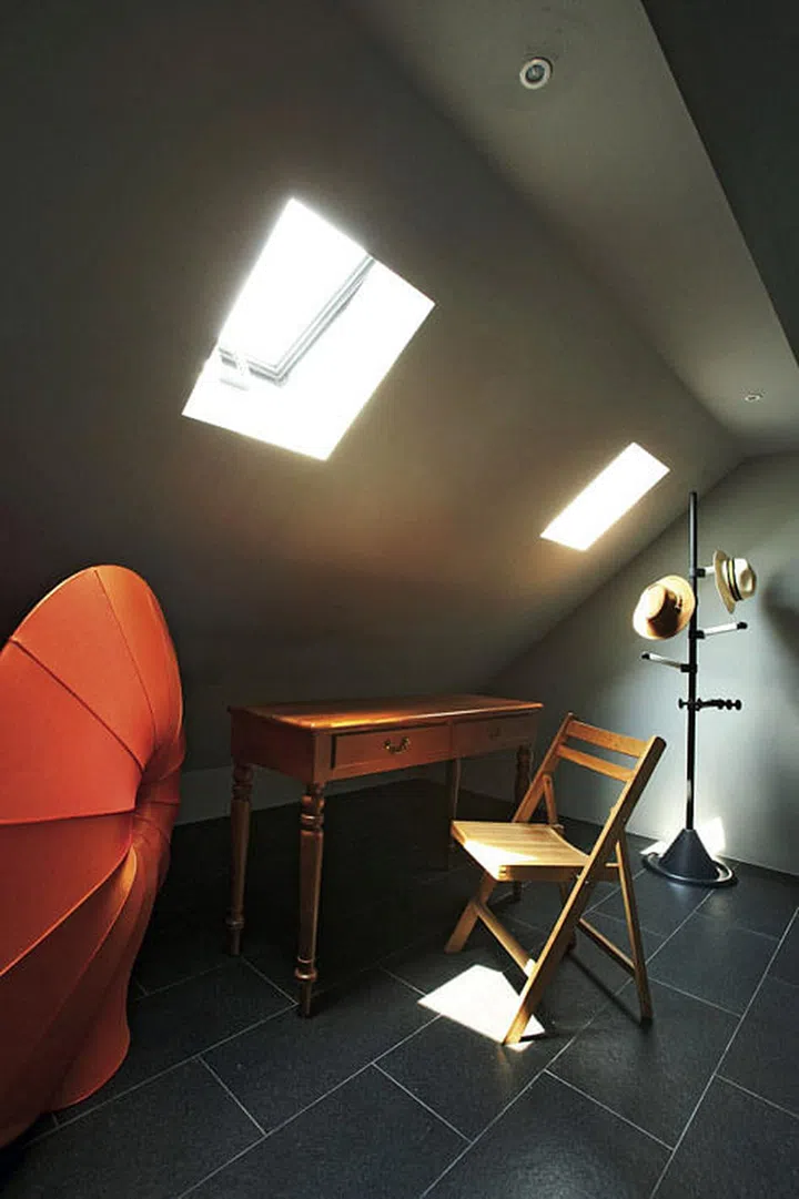 The attic floor has a sparsely furnished spare bedroom for sleepover guests.