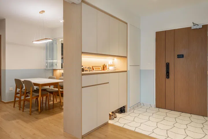 Main door entrance and dining room view of Mr and Mrs Chua’s 4-room BTO in Tampines.
