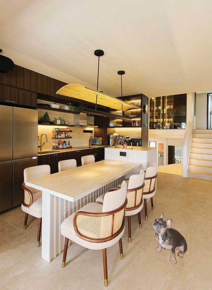 Roundback rattan dining chairs in a 3-bedroom condo (1,800 sq ft) in Pandan Valley, designed by Insight.Out Studio.