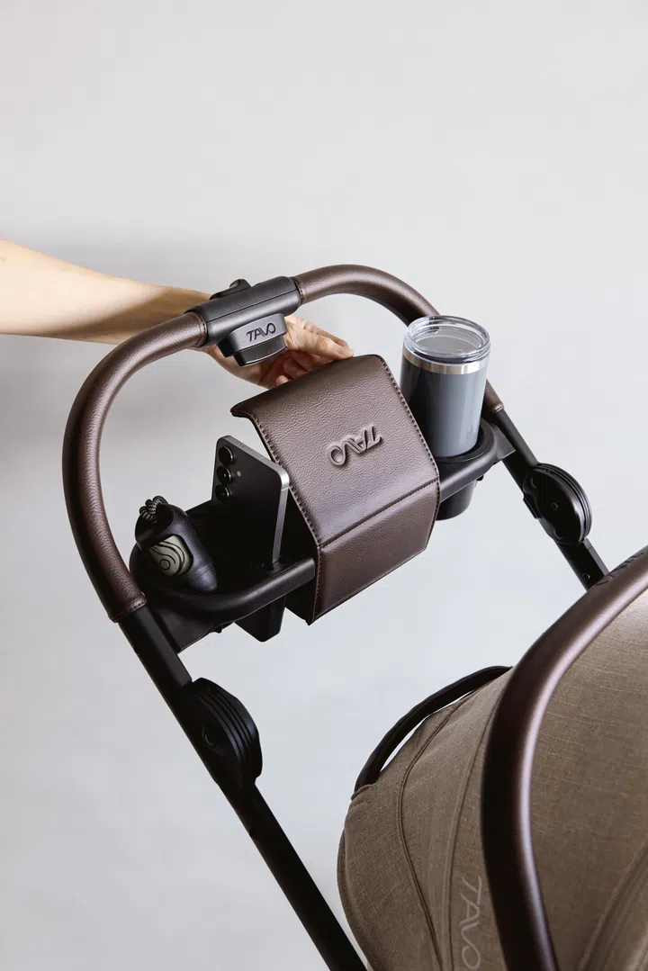 For the humans - a phone holder, cup holder, and a magnet-closure compartment on the Tavo pet stroller.
