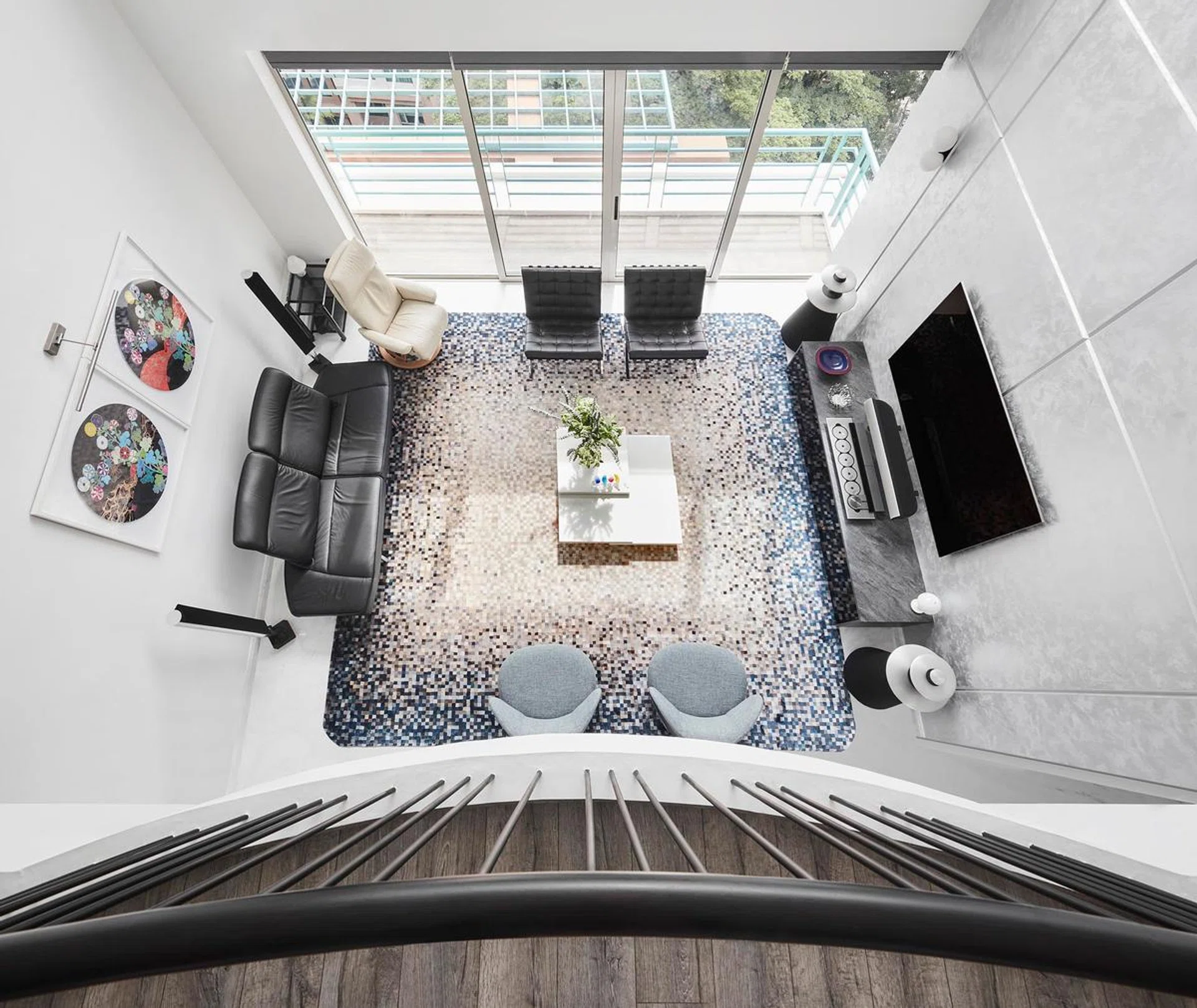 Top down, aerial view of the living room in a penthouse in Bukit Timah.