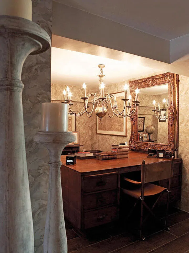 Chandelier placed above a study table in a room with lower ceiling height