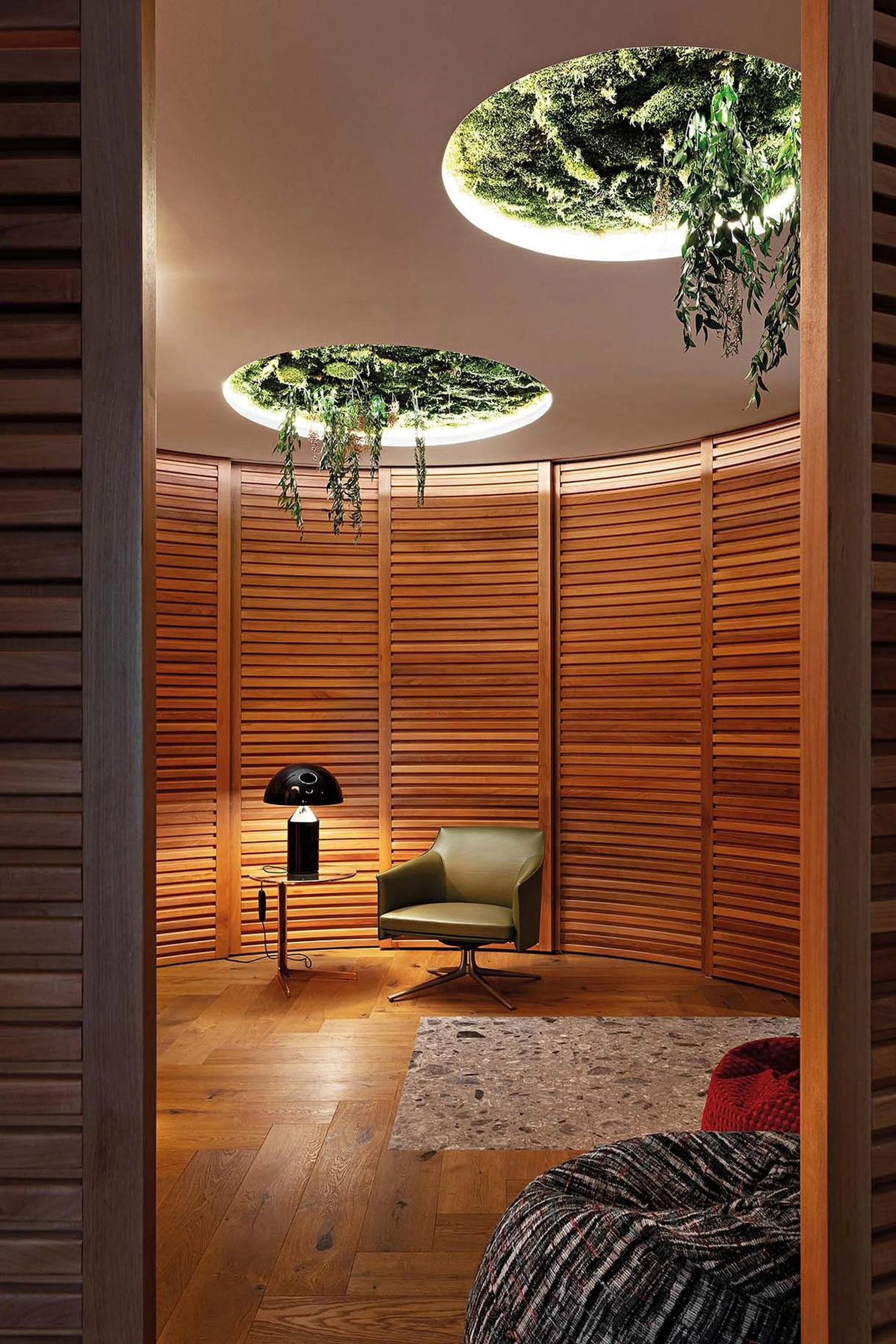 Stanford armchair from Poltrona Frau. Apollo table lamp by Oluce. Baba side table by Poliform