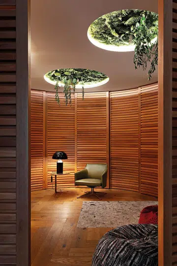 Stanford armchair from Poltrona Frau. Apollo table lamp by Oluce. Baba side table by Poliform