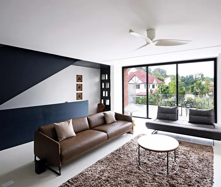 The family area on the second story looks out onto an outdoor terrace above the car porch.