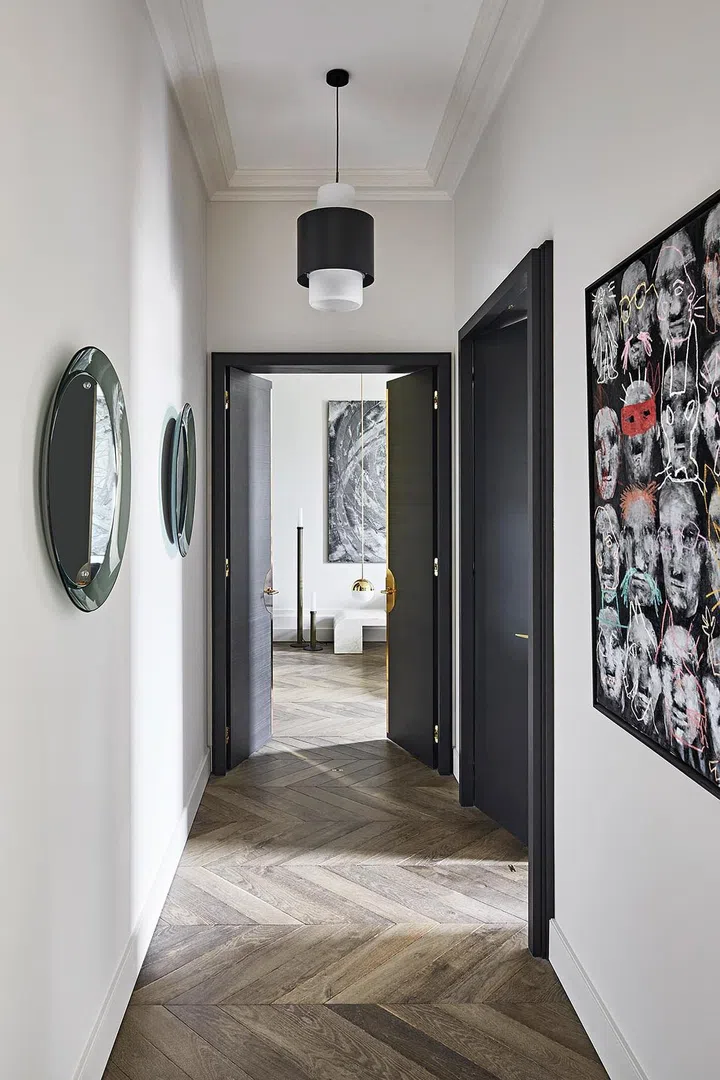 The timber flooring laid in a chevron pattern gives the home a sense of warmth.