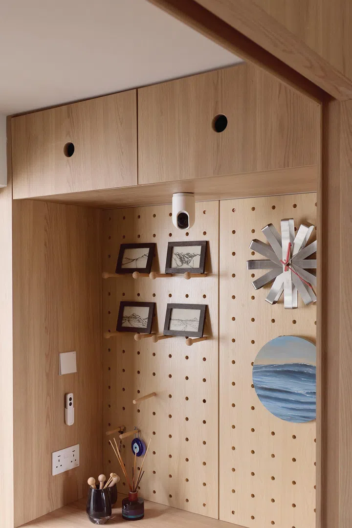 Pegboard walls help to display and organise household items and decor - as seen in architect interior designer Winston Lim (of Winstudio)’s 3-room HDB in Pasir Ris.
