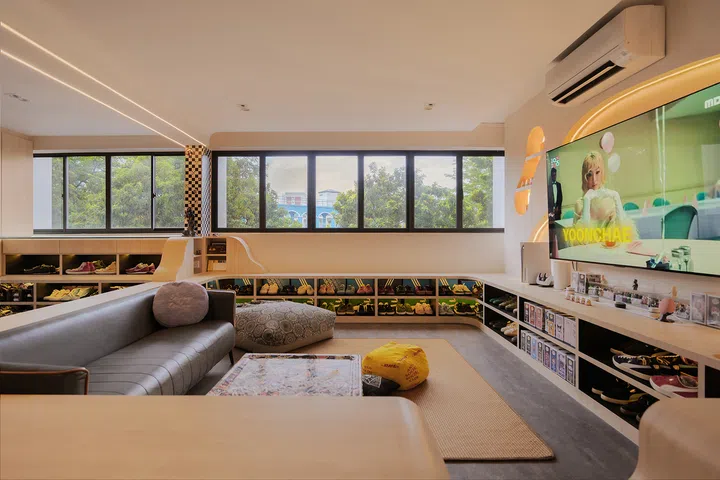 Raised display ledges recreate a sunken living room without lowering the floor.