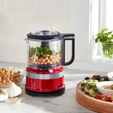 KitchenAid food processor on a kitchen countertop.