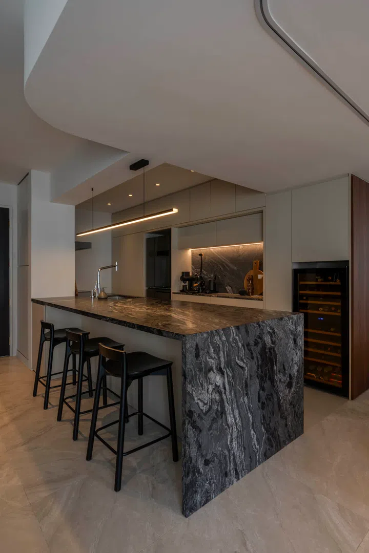 The dramatic granite island is the centrepiece of the home, built for cooking and entertaining.