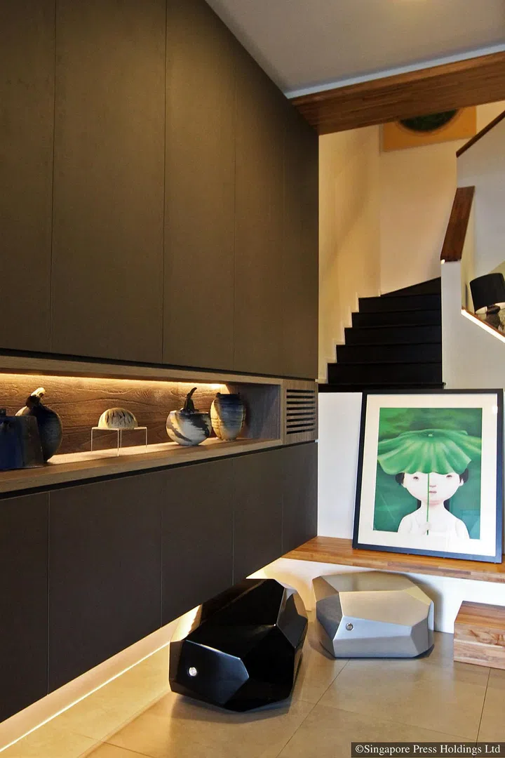 Iskandar Jalil pottery in a display alcove greet guests at the front door of adman Jeff Cheong's three-storey house in Telok Kurau Road.