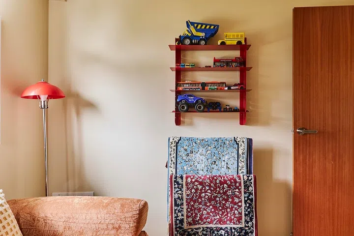 Playful displays, colourful accents and practical furniture ensure the room can easily adapt as the family’s needs continue evolving.