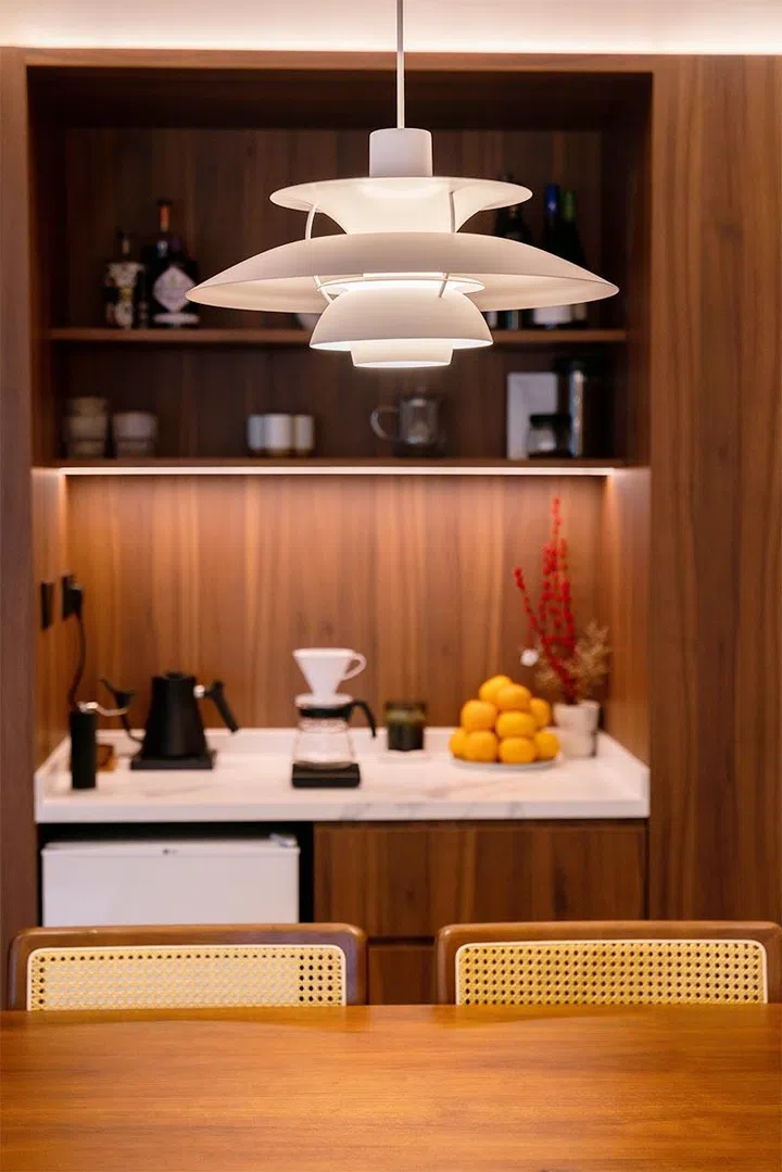 Sintered stone countertops offer a clean, low-maintenance surface while echoing the home’s soft, minimalist aesthetic.