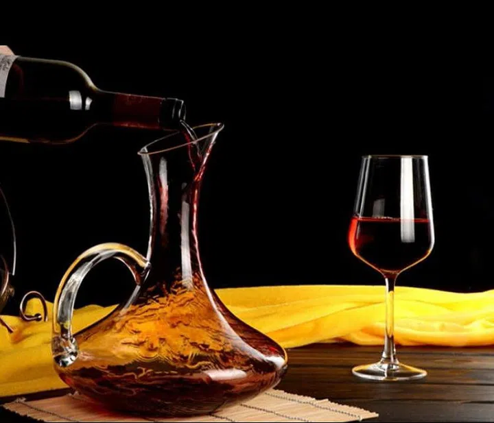 Lead free glass wine decanter with a glass on red wine on the side by Riedel Cabernet
