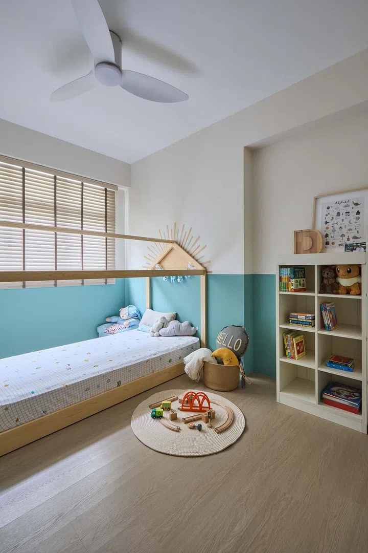 White and teal two-tone coloured walls for the son's bedroom.