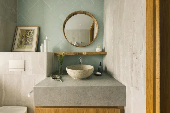 Natural stone freestanding sink in the bathroom of a 1,900 sq ft 3-bedroom condominium in Sentosa.