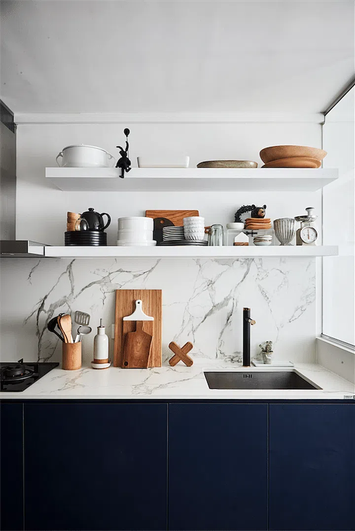 Kitchen with open shelving and decor. These homeowners keep their kitchen daily essentials at an arm's reach. Interior Design by Aart Boxx Interior.