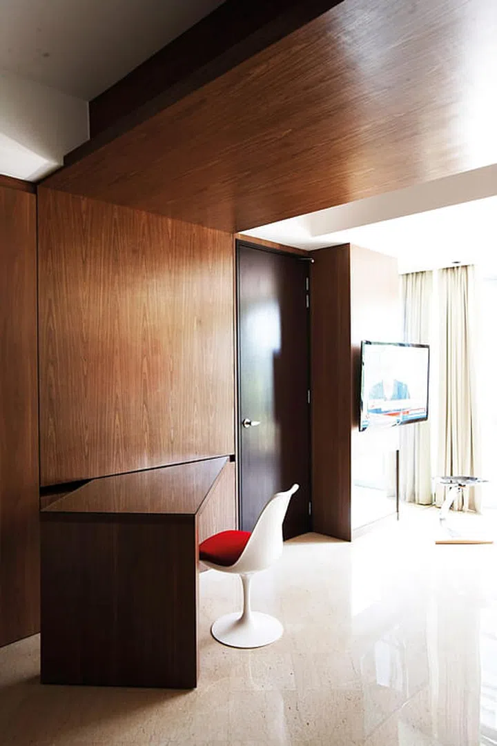 The dining table was designed to swivel into the wall, to be tucked completely out of sight.