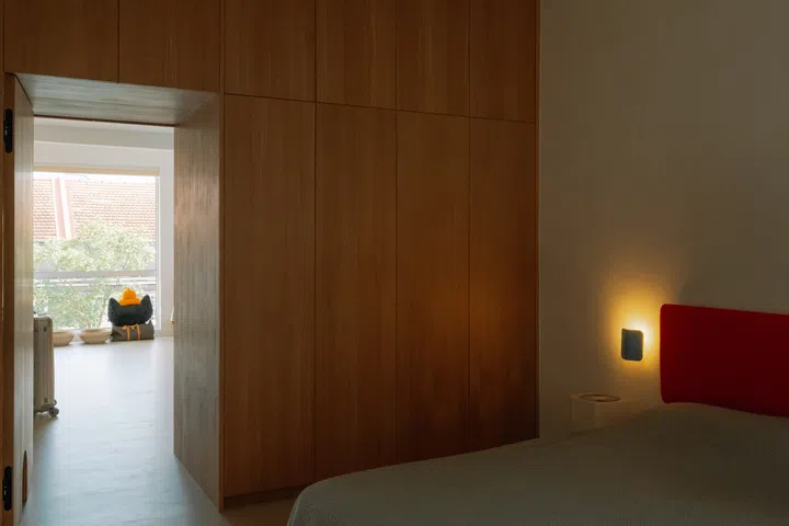 Once envisioned as a three-bedroom apartment, the home now revolves around a generously proportioned master suite connected to the walk-in wardrobe.